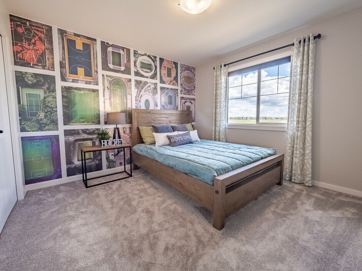 Secondary bedroom in the Kingston showhome by Bedrock Homes
in Rocha in the Orchards, Edmonton.