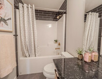 Secondary bathroom in the Kingston showhome by Bedrock Homes
in Rocha in the Orchards, Edmonton.