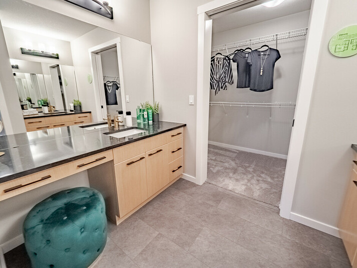 Master bathroom and closet in the Kingston showhome by Bedrock Homes in
Rocha in the Orchards, Edmonton.