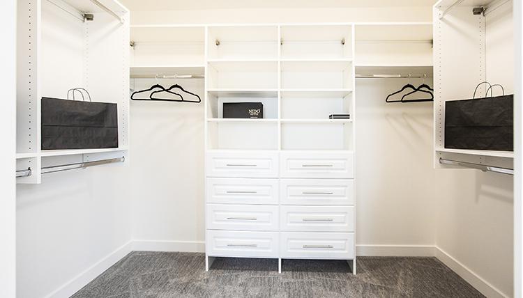 Master walk-in closet in the Isaiah showhome by San Rufo Homes in
Rocha in the Orchards, Edmonton.