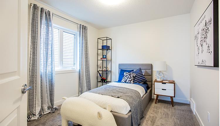 Secondary bedroom in the Isaiah showhome by San
Rufo Homes in Rocha in the Orchards, Edmonton.